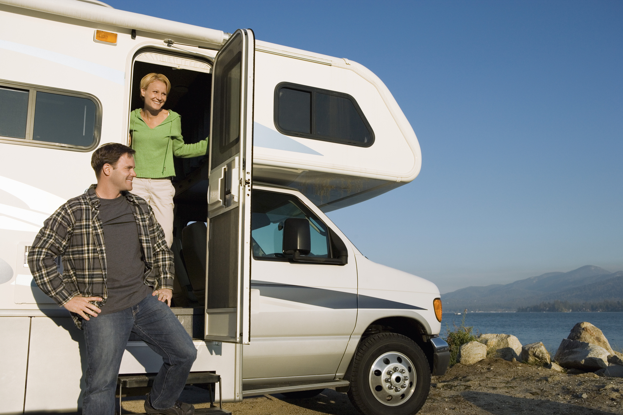 Couple in RV at lakeshore 